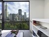 View of the San Francisco skyline from the Sun Room. The bookcase also acts as a guardrail for the stairway. Photo 3 of Telegraph Hill Periscope modern home