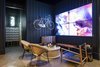 Modern home with Living Room, Bench, Chair, Coffee Tables, Wall Lighting, and Concrete Floor. interior, gathering space Photo of Cru at the Annex - Tasting Room