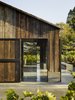 Modern home with Outdoor, Flowers, Wood Fences, Wall, Concrete Patio, Porch, Deck, Trees, Back Yard, and Gardens. Napa Valley barn exterior detail Photo 6 of Napa Vineyard Barn