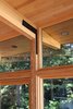 Structural detail showing post to column connection and custom bracket Photo 19 of Higgins Lake House modern home