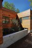 Rear courtyard with tree and basement bedroom windows Photo 17 of Higgins Lake House modern home