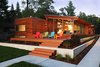 West side of house at sunset Photo 2 of Higgins Lake House modern home