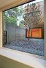View from basement bedroom into courtyard Photo 20 of Higgins Lake House modern home