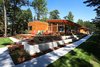 Southwest corner with stepped landscaping Photo 16 of Higgins Lake House modern home