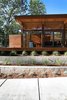 South side with concrete stepped retaining walls Photo 5 of Higgins Lake House modern home