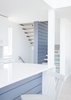Modern home with Kitchen, White Cabinet, Engineered Quartz Counter, Light Hardwood Floor, and Mosaic Tile Backsplashe. Kitchen and stair Photo 10 of Sea Bright House