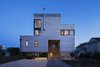 Modern home with Outdoor, Front Yard, Shrubs, Grass, Walkways, and Stone Patio, Porch, Deck. Overall exterior at dusk Photo 9 of Sea Bright House