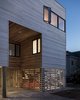 Modern home with Outdoor, Front Yard, and Walkways. Entryway and screened gear enclosure at dusk Photo 4 of Sea Bright House
