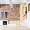 Modern home with Living Room, Track Lighting, Bench, Accent Lighting, Light Hardwood Floor, and Standard Layout Fireplace. Plywood stair and bench seat adjacent to fireplace Photo 6 of Wells Fargo Loft