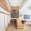 Modern home with Office, Library, Craft Room, Study, Chair, Light Hardwood Floor, Bookcase, and Shelves. Studio space and stair Photo 9 of Wells Fargo Loft