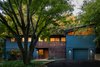 Modern home with Exterior, House Building Type, Wood Siding Material, Shed RoofLine, and Gable RoofLine. Front facade Photo of Deertrack Lane
