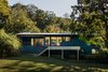 Modern home with Exterior, Shingles Roof Material, House Building Type, Wood Siding Material, and Gable RoofLine. Rear facade Photo 10 of Deertrack Lane