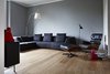 Modern home with Living Room, Chair, Medium Hardwood Floor, Lamps, and Sofa. Living room Photo of The Bosio's house