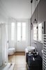 Modern home with Bath Room, Two Piece Toilet, Medium Hardwood Floor, Vessel Sink, Ceiling Lighting, Laminate Counter, Full Shower, and Open Shower. Guest Bathroom Photo 5 of The Bosio's house