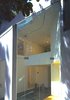 Glass doorway to garden, split level and balconies behind Photo 3 of Casa Lila modern home