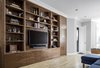Modern home with Living Room, Ceiling Lighting, Bookcase, and Light Hardwood Floor. Entry/Living Room Photo of Harlem Renaissance