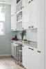 Modern home with Kitchen, White Cabinet, Light Hardwood Floor, Glass Tile Backsplashe, and Pendant Lighting. Kitchen Photo 7 of Harlem Renaissance