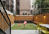 Modern home with Outdoor, Back Yard, Raised Planters, Planters Patio, Porch, Deck, Wood Fences, Wall, Horizontal Fences, Wall, and Post Lighting. Backyard Photo 10 of Harlem Renaissance