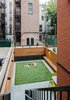 Modern home with Outdoor, Back Yard, Raised Planters, Planters Patio, Porch, Deck, Horizontal Fences, Wall, Wood Fences, Wall, and Post Lighting. Backyard Photo 11 of Harlem Renaissance