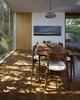 Modern home with Dining Room, Chair, Ceiling Lighting, Table, Recessed Lighting, and Medium Hardwood Floor. Dining Room Photo of NHN House