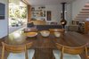 Modern home with Dining Room, Chair, Table, Recessed Lighting, Medium Hardwood Floor, and Hanging Fireplace. Dining Room Photo 2 of NHN House