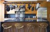 Modern home with Kitchen, Wood Cabinet, Ceiling Lighting, Stone Slab Backsplashe, Recessed Lighting, Stone Counter, Range, Refrigerator, Undermount Sink, and Range Hood. Kitchen Photo 5 of NHN House
