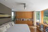 Modern home with Bedroom, Bed, Bookcase, Storage, Ceiling Lighting, Dresser, Recessed Lighting, and Medium Hardwood Floor. Master Bedroom Photo 6 of NHN House