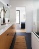 Modern home with Bath Room, Engineered Quartz Counter, Porcelain Tile Floor, Wall Lighting, Subway Tile Wall, Undermount Sink, and Undermount Tub. Bathroom Photo 6 of Tilt-Shift House