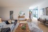 Modern home with Living Room, Light Hardwood Floor, Sofa, Console Tables, Chair, Ottomans, and Recessed Lighting. Living Room Photo 20 of Tilt-Shift House