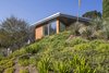 Modern home with Exterior, House Building Type, Metal Roof Material, Wood Siding Material, Metal Siding Material, Stucco Siding Material, and Butterfly RoofLine. Exterior Front Photo 3 of View House