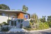 Modern home with Exterior, House Building Type, Metal Roof Material, Wood Siding Material, Stucco Siding Material, Metal Siding Material, and Butterfly RoofLine. Exterior Front Photo 2 of View House