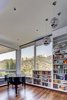 Modern home with Living Room, Bookcase, Ceiling Lighting, Pendant Lighting, and Medium Hardwood Floor. Living Room Photo 7 of View House
