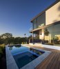 Modern home with Exterior, Metal Roof Material, House Building Type, Flat RoofLine, Stucco Siding Material, and Concrete Siding Material. Exterior Photo of SL House