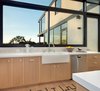 Modern home with Kitchen, Ceramic Tile Backsplashe, Dishwasher, Engineered Quartz Counter, Medium Hardwood Floor, Vessel Sink, and Wood Cabinet. Kitchen Photo 14 of SL House