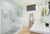 Modern home with Bath Room, Subway Tile Wall, Open Shower, Medium Hardwood Floor, Undermount Sink, Recessed Lighting, Ceiling Lighting, One Piece Toilet, and Engineered Quartz Counter. Master Bathroom Photo 18 of SL House
