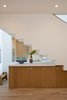Modern home with Dining Room, Recessed Lighting, Ceiling Lighting, Medium Hardwood Floor, and Storage. View to Kitchen Photo 9 of SL House