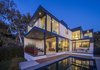 Modern home with Exterior, Concrete Siding Material, House Building Type, Flat RoofLine, Metal Roof Material, and Stucco Siding Material. Exterior Photo 2 of SL House