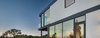 Modern home with Exterior, House Building Type, Metal Roof Material, Concrete Siding Material, Flat RoofLine, and Stucco Siding Material. Exterior Photo 6 of SL House