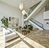Modern home with Living Room, Medium Hardwood Floor, Console Tables, Pendant Lighting, Sofa, Recessed Lighting, Coffee Tables, and Chair. Living Room Photo 3 of Echo House