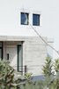 Modern home with Exterior, Glass Siding Material, Flat RoofLine, House Building Type, Concrete Siding Material, and Metal Siding Material. faccade details Photo 16 of CK House