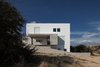 Modern home with Exterior, Stucco Siding Material, Concrete Siding Material, Glass Siding Material, Flat RoofLine, House Building Type, and Metal Siding Material. east elevation - volumes and textures.... Photo of CK House