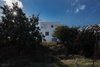 Modern home with Exterior, Stucco Siding Material, Flat RoofLine, Glass Siding Material, and House Building Type. north elevation - a fortress into landscape - Photo 18 of CK House