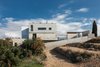 Modern home with Exterior, Stucco Siding Material, Flat RoofLine, House Building Type, Stone Siding Material, and Concrete Siding Material. west elevation Photo 11 of CK House