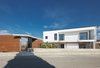 Modern home with Exterior, Stucco Siding Material, Stone Siding Material, Concrete Siding Material, House Building Type, Flat RoofLine, and Metal Siding Material. front elevation - towards south Photo 7 of CK House