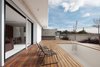 Modern home with Outdoor, Concrete Fences, Wall, Wood Patio, Porch, Deck, Front Yard, Stone Fences, Wall, Large Patio, Porch, Deck, and Small Pools, Tubs, Shower. inside out - living outdoors Photo 6 of CK House