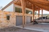 All the sheds, including the garage, have clerestory windows. The carport and garage can be emptied of cars and used as a large, covered space for outdoor parties. Photo 15 of The Goat Sheds modern home