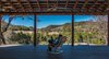 This is the view from the back porch of the Great Room. With a 14'-depth it becomes an outdoor room for eating, bird watching, and wondering. Photo 16 of The Goat Sheds modern home