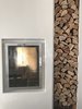 Modern home with Living Room, Recliner, Ceiling Lighting, Light Hardwood Floor, and Wood Burning Fireplace. Fire in bedroom and living area Photo 13 of Ritz Rest