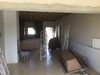 Modern home with Kitchen, Refrigerator, Cooktops, Ice Maker, Dishwasher, Engineered Quartz Counter, White Cabinet, Light Hardwood Floor, Glass Tile Backsplashe, Microwave, Ceiling Lighting, and Undermount Sink. Get rid of tiles Photo 7 of Ritz Rest