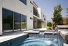 Modern home with Apartment Building Type, Green Roof Material, Stucco Siding Material, Outdoor, Side Yard, Trees, Wood Fences, Wall, Landscape Lighting, Lap Pools, Tubs, Shower, and Concrete Patio, Porch, Deck. Private patio and pool
Photo 8 of The Monarch